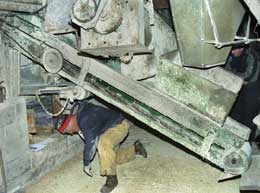 Photo 6 shows how the farmer had to routinely duck under the conveyor from side to side to access the switch panel. 