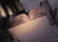 Photo 3. Burned “V” Shape in Bus Bar Plates