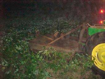 Figure 3. Brush hog after tractor turned upright by tow company
