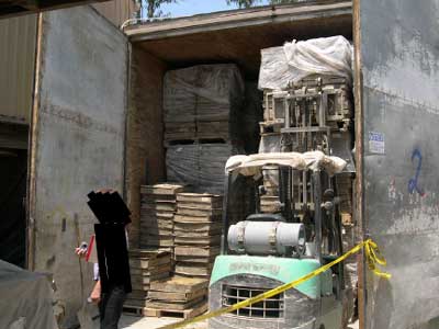 Exhibit 1. The incident scene showing the curing oven and the position of the forklift when the incident occurred. 
