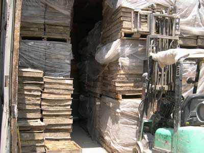 Exhibit 2. The incident scene showing the concrete and stone castings stacked on pallets in the curing oven. The pallets on the left collapsed onto the victim. 