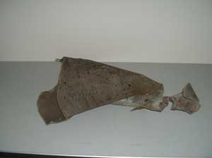 Exhibit 6: A piece of the exploded tank showing the inner  wall and oily substance.