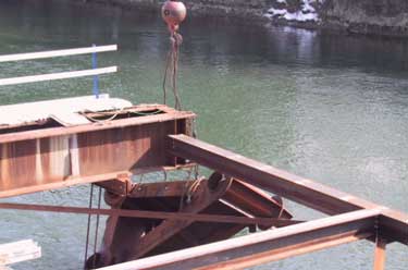 Photo 4. The collapsed pile cap hung by the test chain.