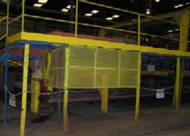 View of stacker shows barricaded undercarriage where incident occurred.