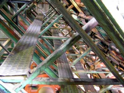 Catwalks in the tower planer provided 
		  access to areas where lumber occasionally jammed in the conveyor system.