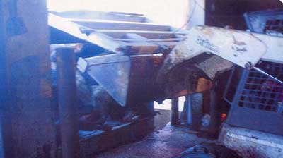 Figure 3. Semi trailer gate is raised with the Bobcat.