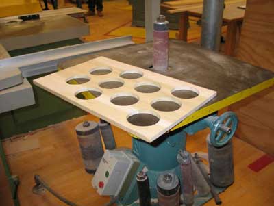 Wood piece being sanded