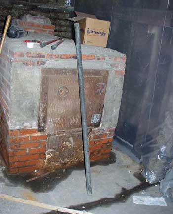 Attachment 5. Metal pipe being used to brace boards/sheeting.