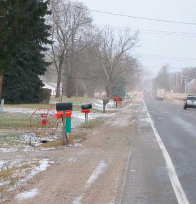 row of orange newspaper boxes
