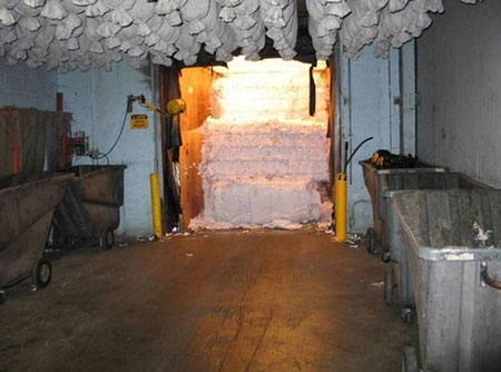 Incident location with a tractor trailer loaded with paper bales not on pallets.