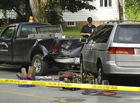 Scene after the incident, wrecked truck and vehicle.