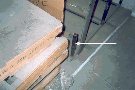 Figure 5 - L-shaped metal tubing that slid into the same opening in the pallet as the order picker tines connecting the guardrail to the pallet.
