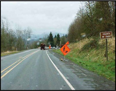 work zone signs traveling eastbound heading toward the incident site which is just beyond the curve on the highway