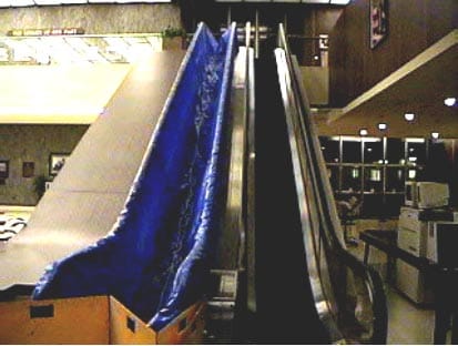 Exhibit #1. View of the escalators running between the lobby and second floor of the courthouse. The escalator on the left was involved in the incident.