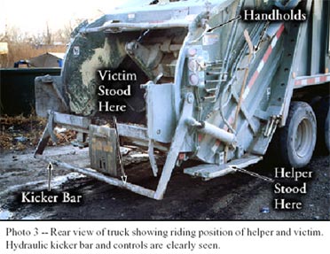 Photo 3 - Rear view of truck showing riding position of helper and victim.  Hydraulic kicker bar and controls are clearly seen.