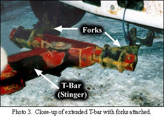 close-up of extended T-bar with forks attached.