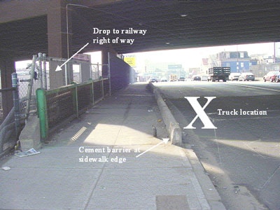Figure 3 – Truck location. Sidewalk and cement barrier at edge