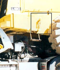 Figure 12. Chain located on loader, driver’s side