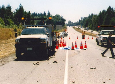 incident scene after emergency response, facing west, looking up the hill toward on-coming traffic
