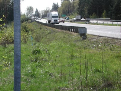 Possible roadside option site at the bottom of the hill where a trailer might be able to load/unload. This site would give good protection, behind a guardrail