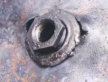 Photo 3 – Close-up of bung hole showing broken welds that were being repaired.