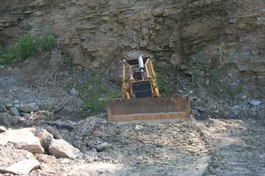 Bulldozer in the side of the mountain.
