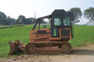 A picture of the bulldozer after it had been partially cleaned up and repaired.