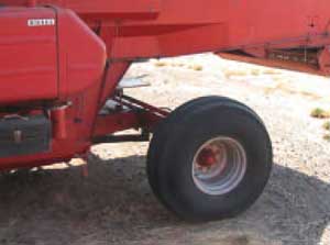 Photo 2. Space between rear tires and combine body and short narrow deflection shield.