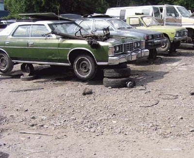 incident site showing the green vehicle from which the customer was extracting the engine and transmission unit