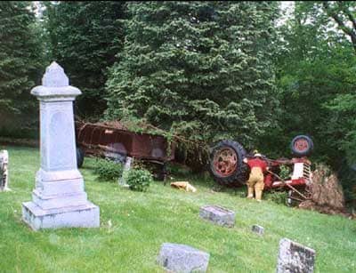 overturned tractor in cemetery