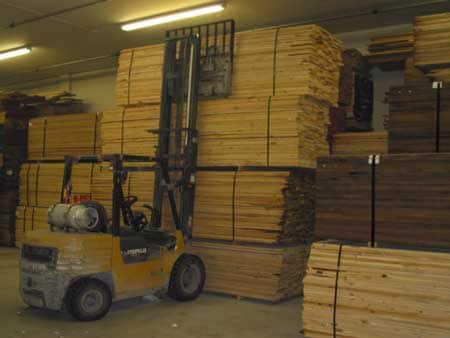 Figure 1. The forklift stacking the fourth bundle of lumber.