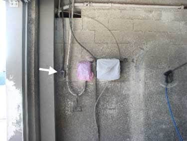 Exhibit 6: A picture of the control switches at the entrance of the car wash tunnel.