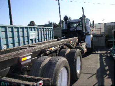 Exhibit 1: A picture of a roll-off truck similar to the one involved in the incident. 