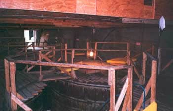 Figure 4. Inside of tank storage room-wood decking on and between tanks.