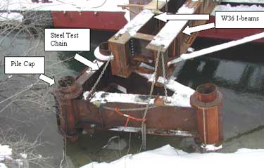 Photo 1. A pile cap that was attached to a pair of W36 I-beams and secured with a 12,000 lb. steel test chain.