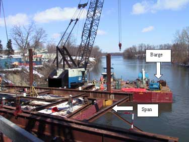 Photo 2. Overview of the barge and workstation where the temporary bridge span was placed and being dismantled.