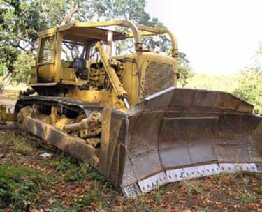 The Caterpillar D8H bulldozer in this incident unexpectedly rolled backward from a parked position.