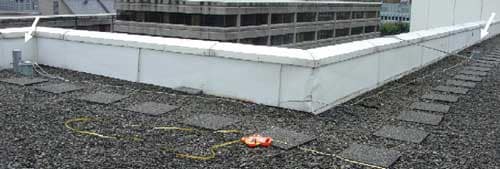 Two certified anchor points are visible here on the roof of the building where the incident occurred.