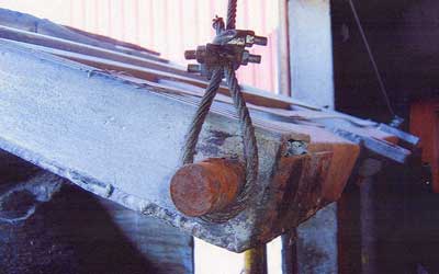 Figure 2. The locking pin and wire sling on the semi trailer gate.