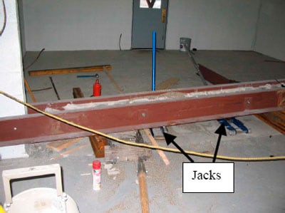 jacks under a header beam on the floor