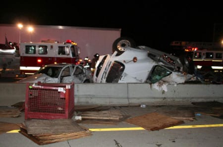 Photograph of semi and car involved in fatal crash. 