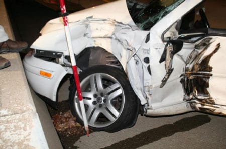 Photograph of car involved in crash. 