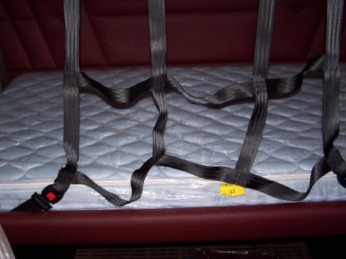 Photograph of a restraint system in a similar sleeper berth. 