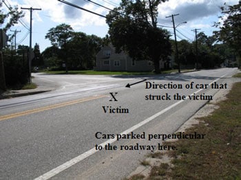 The intersection where the incident occurred. The state highway is the roadway with the solid double yellow lines.