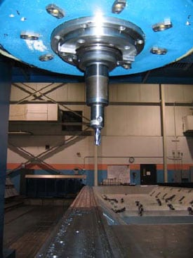 Figure 1. Cutting head of vertical gantry mill and part being machined.