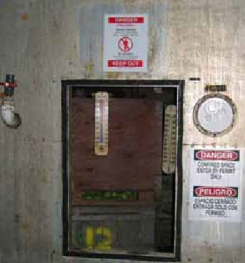 Figure 6. All doors to the CA rooms in the facility have the required Confined Space signs (in Spanish and English) affixed.