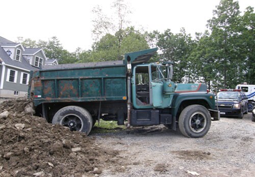 The dump truck that crushed the victim at the residential construction site.