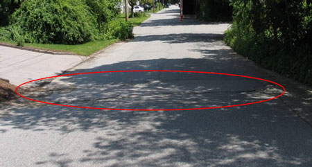 Location of the incident. Roadway depression is circled in red.