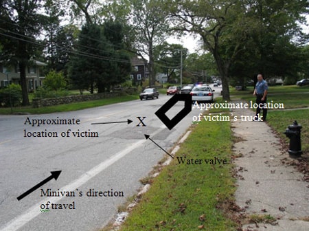 Incident location, street and man on sidewalk.