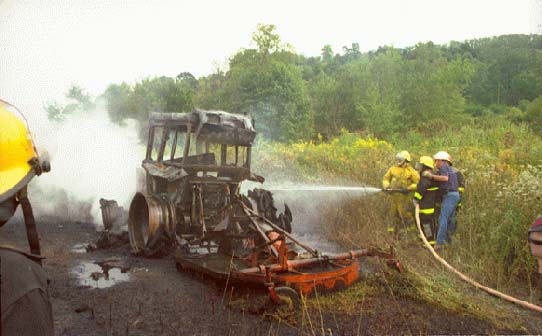 photo of tractor and surrounding burnt ground